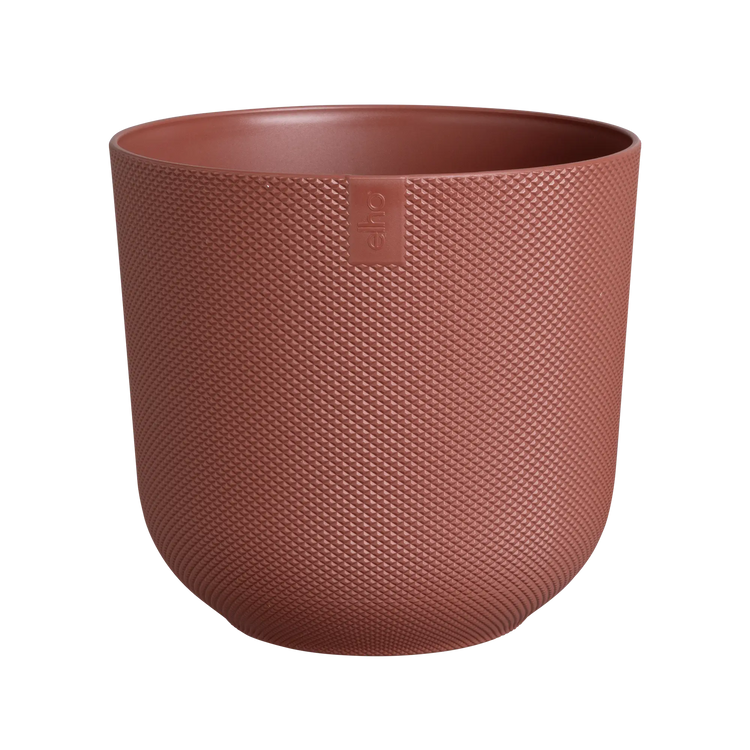 An Elho Jazz Round Tuscan Red coloured pot