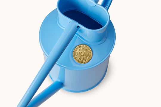 Haws Fazeley Flow Two Pint Sky Blue watering can in front of a white background