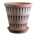 Terracotta planter with ribbed texture on a white background