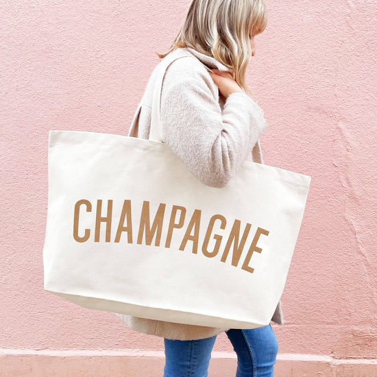 Natural Really Big Bag with ‘Champagne’ Text on a Pink Background