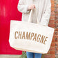 Natural Really Big Bag with ‘Champagne’ Text on a Neutral Background