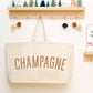 Natural Really Big Bag with ‘Champagne’ Text on a White Background