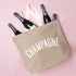 Stone Canvas Tote Bag with ‘Champagne’ text on a Pink Background