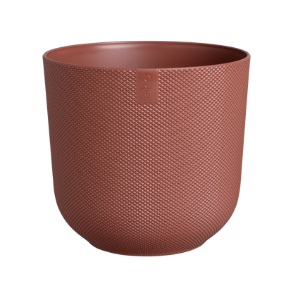 An Elho Jazz Round Tuscan Red coloured pot