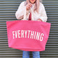 Bright Pink Really Big Bag with ‘Everything’ Text on a Green Background