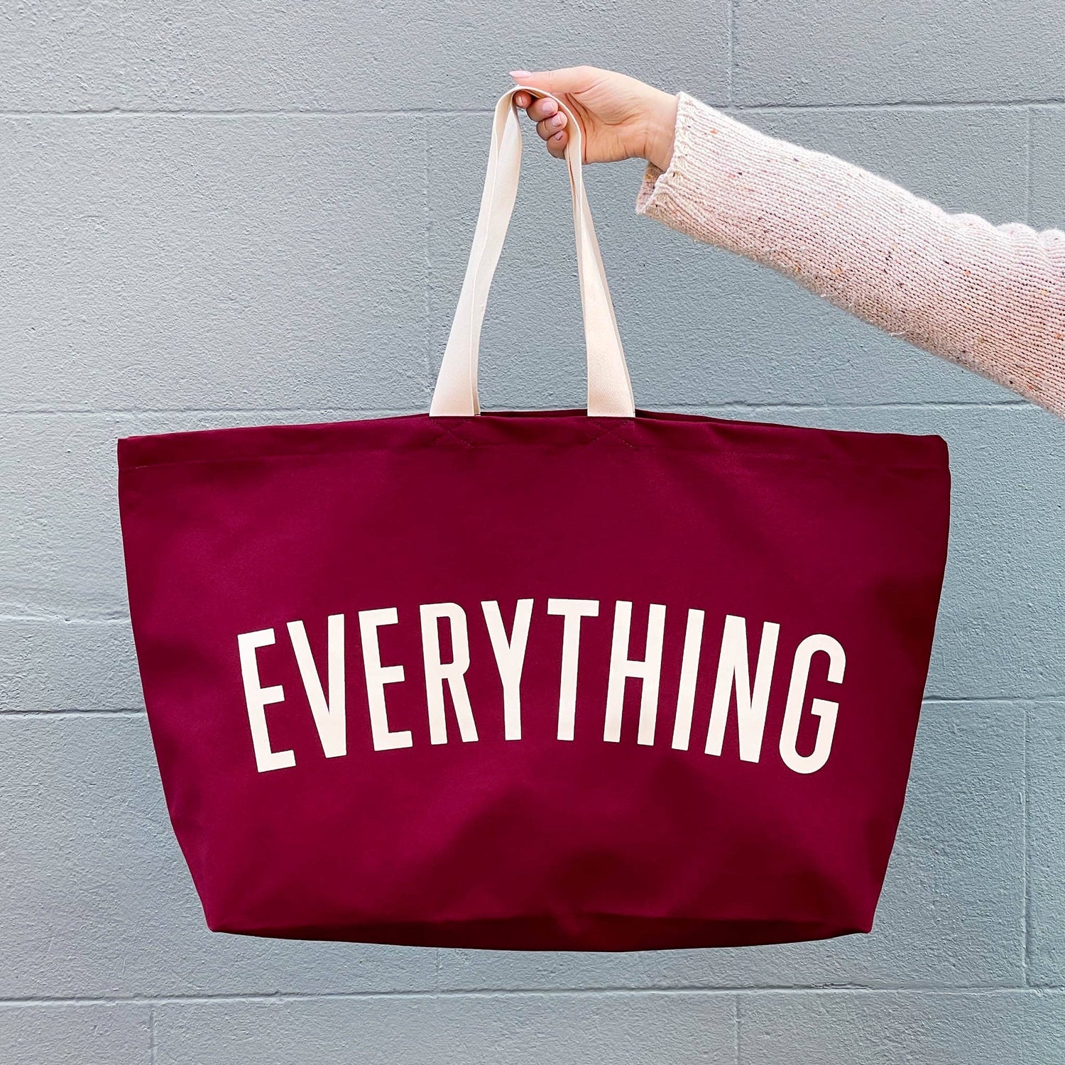 Burgundy Really Big Bag with ‘Everything’ Text on a Blue Background