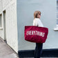 Burgundy Really Big Bag with ‘Everything’ Text on a Mixed Background