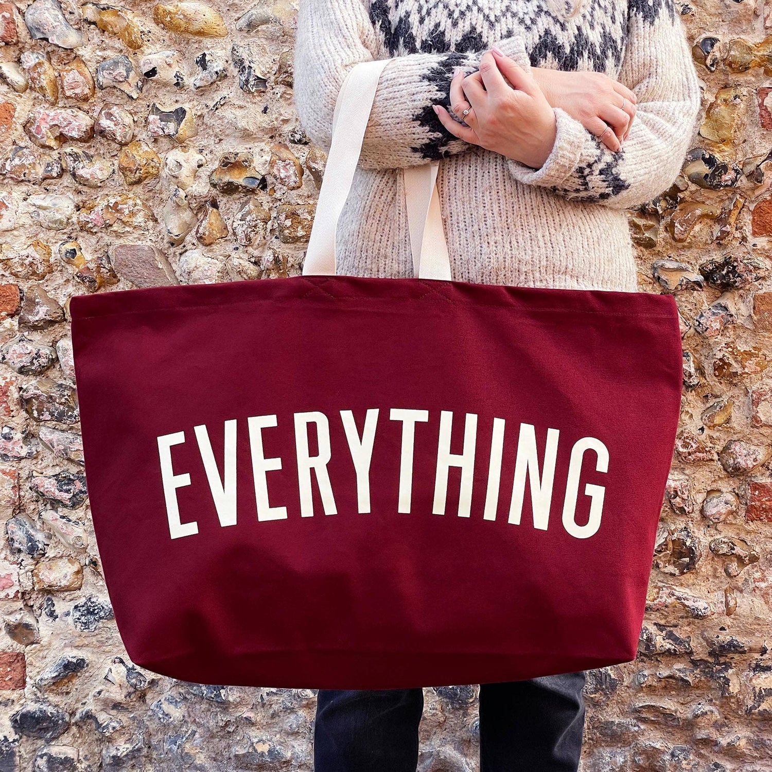 Burgundy Really Big Bag with ‘Everything’ Text on a Mixed Background