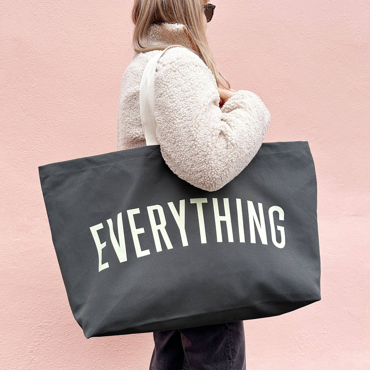Grey Really Big Bag with ‘Everything’ Text on a Pink Background