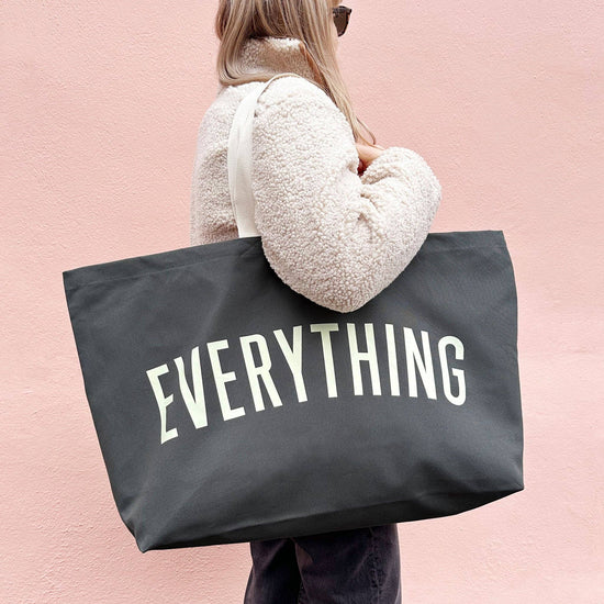 Grey Really Big Bag with ‘Everything’ Text on a Pink Background