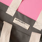 Grey Really Big Bag with ‘Everything’ Text on a Pink Background