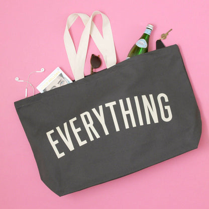 Grey Really Big Bag with ‘Everything’ Text on a Pink Background