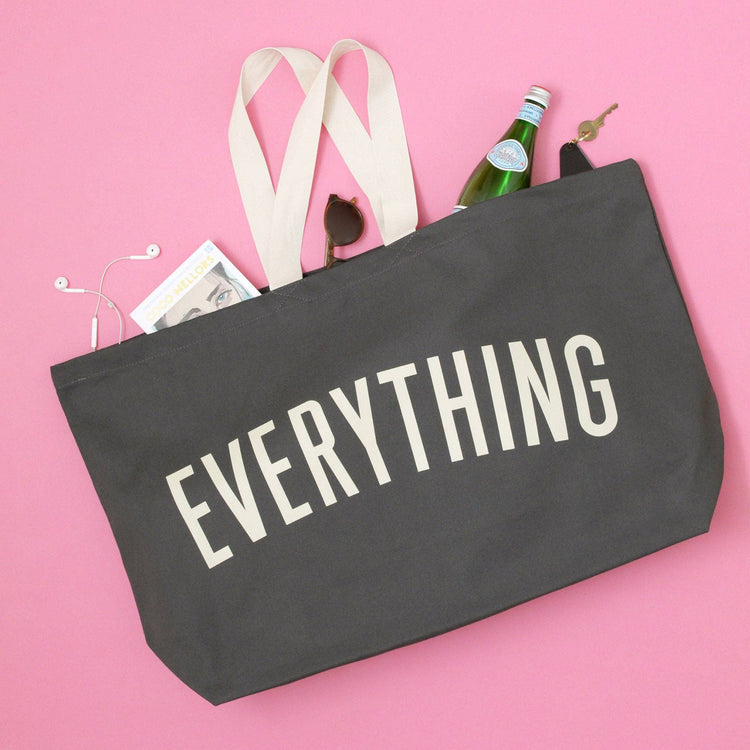 Grey Really Big Bag with ‘Everything’ Text on a Pink Background