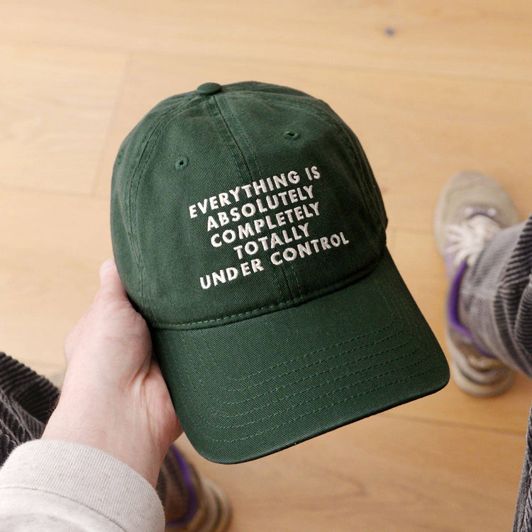 Cotton Baseball Cap with ‘Everything is Under Control’ text on a Neutral Background