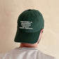 Person Wearing a Cotton Baseball Cap with ‘Everything is Under Control’ text on a white Background