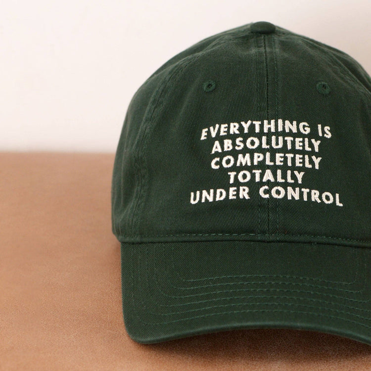 Cotton Baseball Cap with ‘Everything is Under Control’ text on a neutral Background