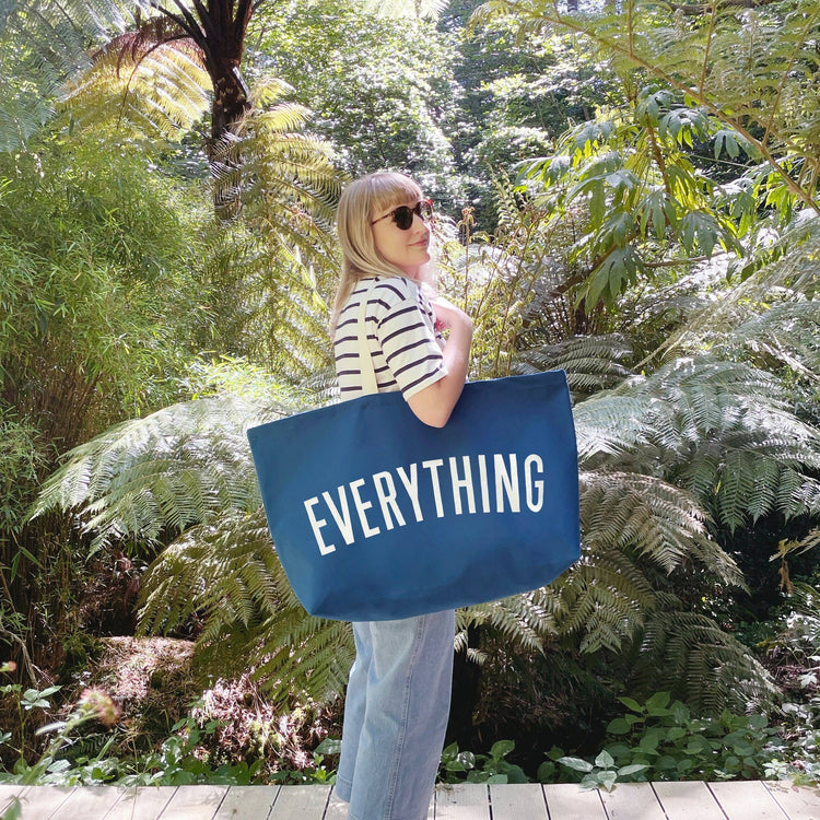 Ocean Blue Really Big Bag with ‘Everything’ Text on a Leafy Background