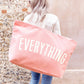 Person Carrying a Pink Really Big Bag with ‘Everything’ Text on a Neutral Background