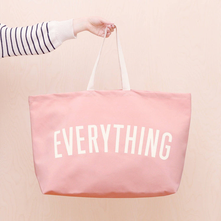 Pink Really Big Bag with ‘Everything’ Text on a Neutral Background