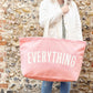 Person Carrying a Pink Really Big Bag with ‘Everything’ Text on a Neutral Background