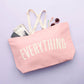 Pink Really Big Bag with ‘Everything’ Text on a Blue Background