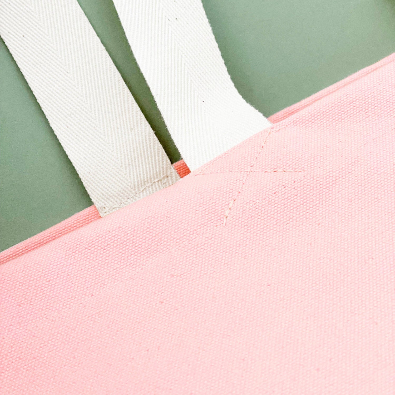 Pink Really Big Bag with ‘Everything’ Text on a Green Background