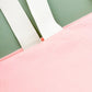 Pink Really Big Bag with ‘Everything’ Text on a Green Background