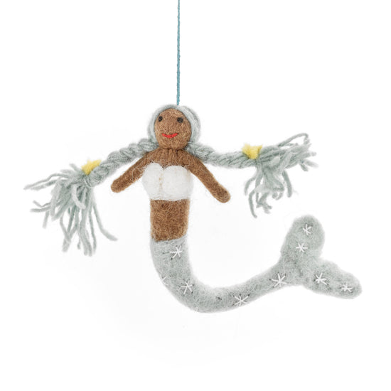Mermaid ornament with gray hair and tail on a white background