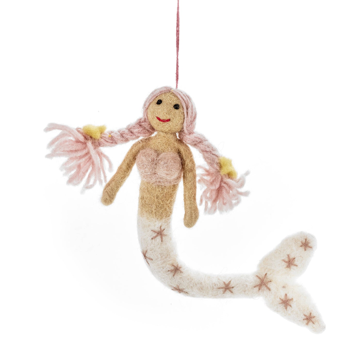 Knitted mermaid doll with pink hair and starfish tail on a white background