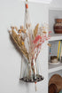 Hanging macrame plant shelf that rests neatly against the wall. Bold and graphic black and white print with natural white macrame twine and brass plated hoops. Made in England. 