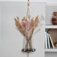 Hanging macrame plant shelf that rests neatly against the wall. Bold and graphic black and white print with natural white macrame twine and brass plated hoops. Made in England. 