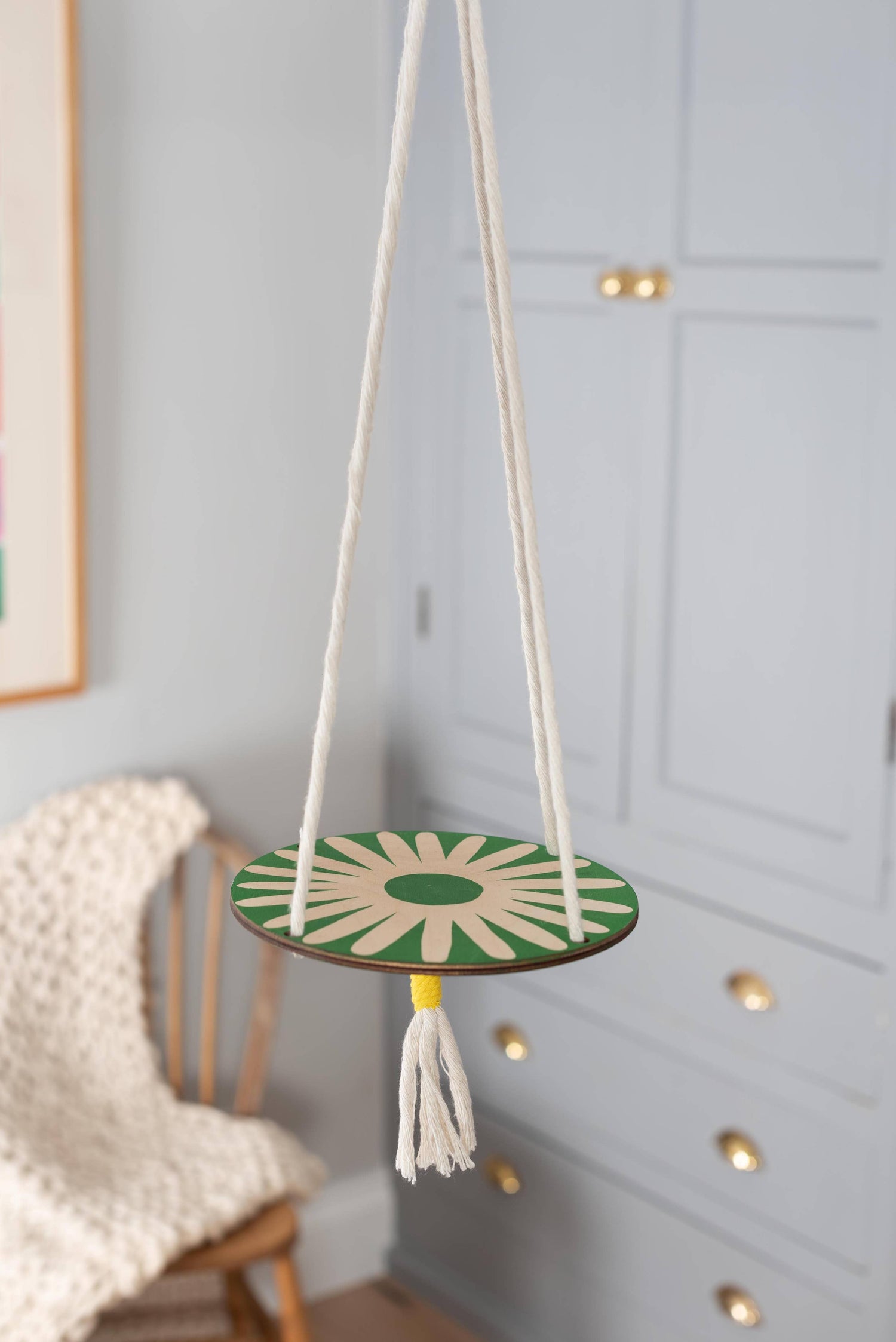 Hanging macrame plant shelf. Green and white daisy print with natural white macrame twine and brass plated hoops. Made in England. 