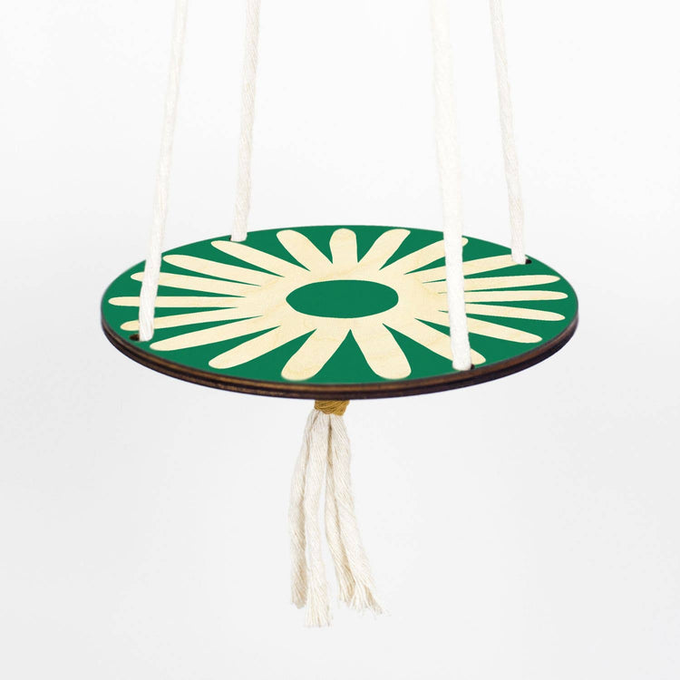 Hanging macrame plant shelf. Green and white daisy print with natural white macrame twine and brass plated hoops. Made in England. 