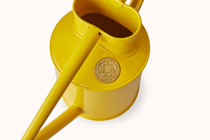 Haws Fazeley Flow Two Pint Lotus Yellow watering can in front of a white background