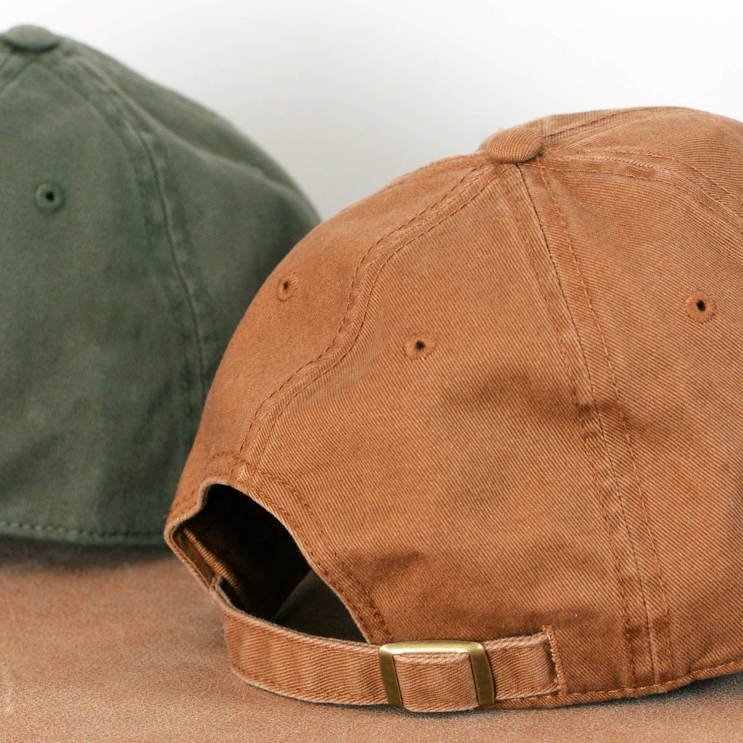 Cotton Baseball Cap with ‘I Think I Need More Coffee’ Text on a neutral Background
