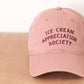 Dusty Rose Cotton Baseball Cap with ‘Ice Cream Appreciation Society’ Text on a Neutral Background