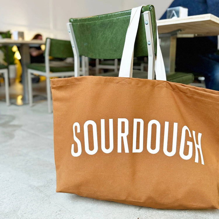 Brown tote bag with &