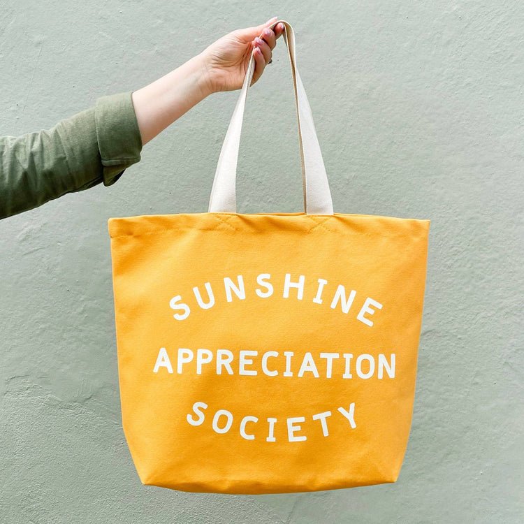 Yellow tote bag with &