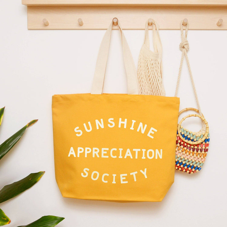 Yellow tote bag with &