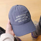 Vintage Blue Cotton Baseball Cap with ‘Sunshine Appreciation Society’ Text on a Neutral Background
