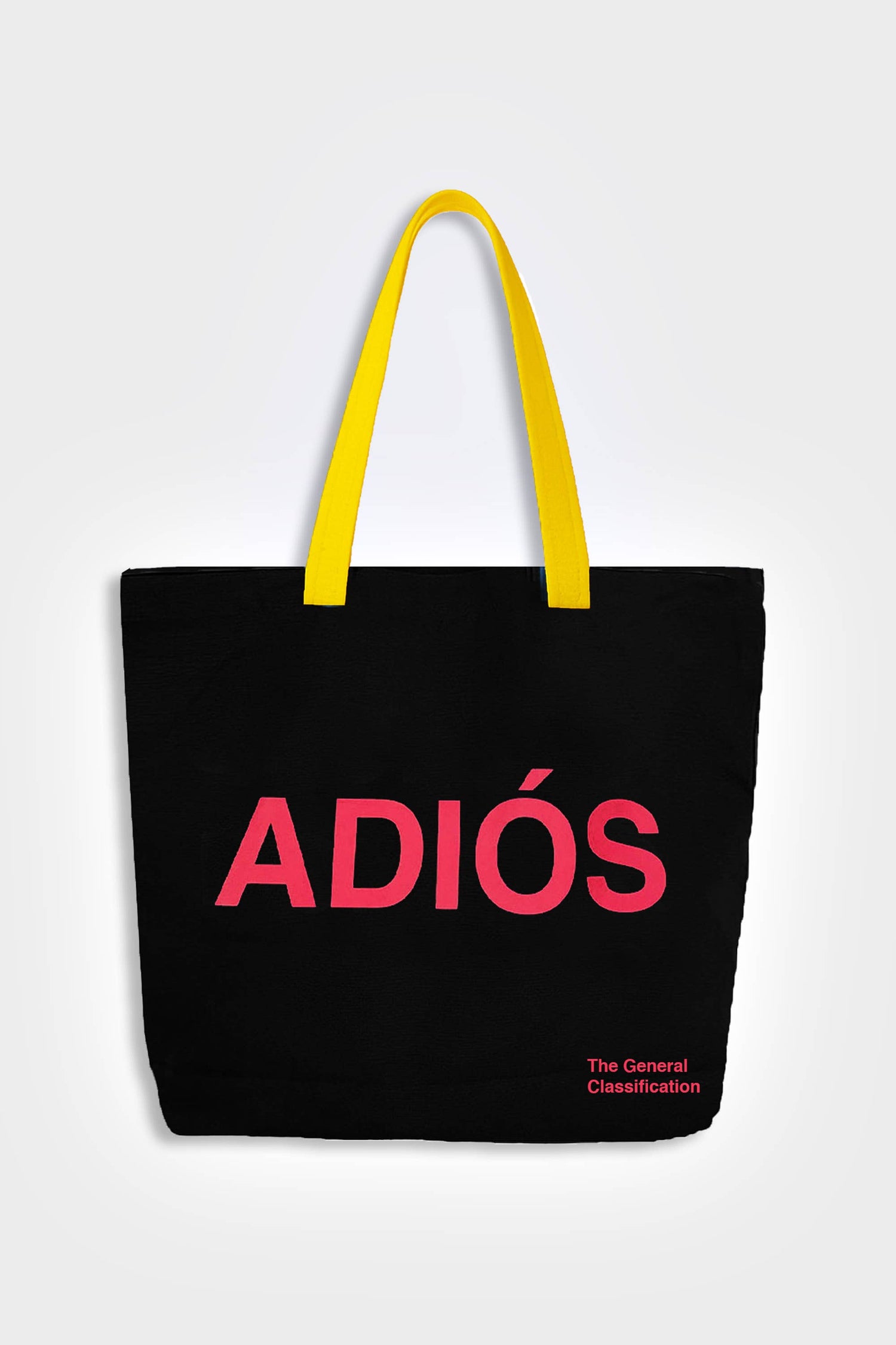 Black reusable canvas tote bag with yellow handles and bold red "Hola" and ‘Adiós’ graphic by The General Classification. Eco-friendly cotton shopping bag with modern minimalist design, ideal for everyday use, groceries, travel, and casual fashion.