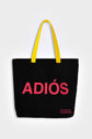 Black reusable canvas tote bag with yellow handles and bold red "Hola" and ‘Adiós’ graphic by The General Classification. Eco-friendly cotton shopping bag with modern minimalist design, ideal for everyday use, groceries, travel, and casual fashion.