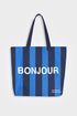 Blue and navy stripe reusable canvas tote bag with navy handles and bold white "Bonjour" and ‘Au Revoir’ graphic by The General Classification. Eco-friendly cotton shopping bag with modern minimalist design, ideal for everyday use, groceries, travel, and casual fashion.
