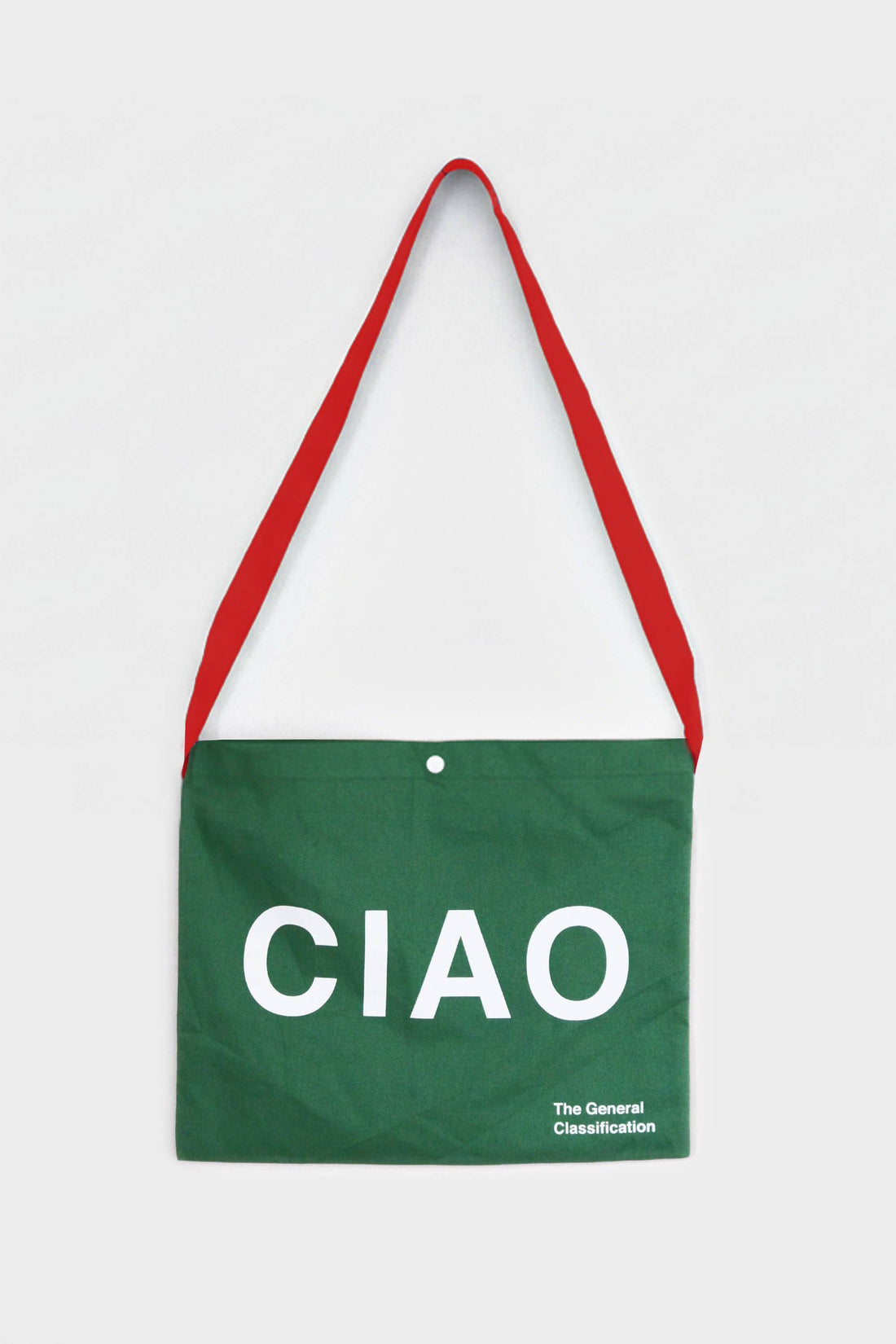 Green reusable canvas tote bag with red handles and bold white "Ciao" and ‘Arrivederci’ graphic by The General Classification. Eco-friendly cotton shopping bag with modern minimalist design, ideal for everyday use, groceries, travel, and casual fashion.