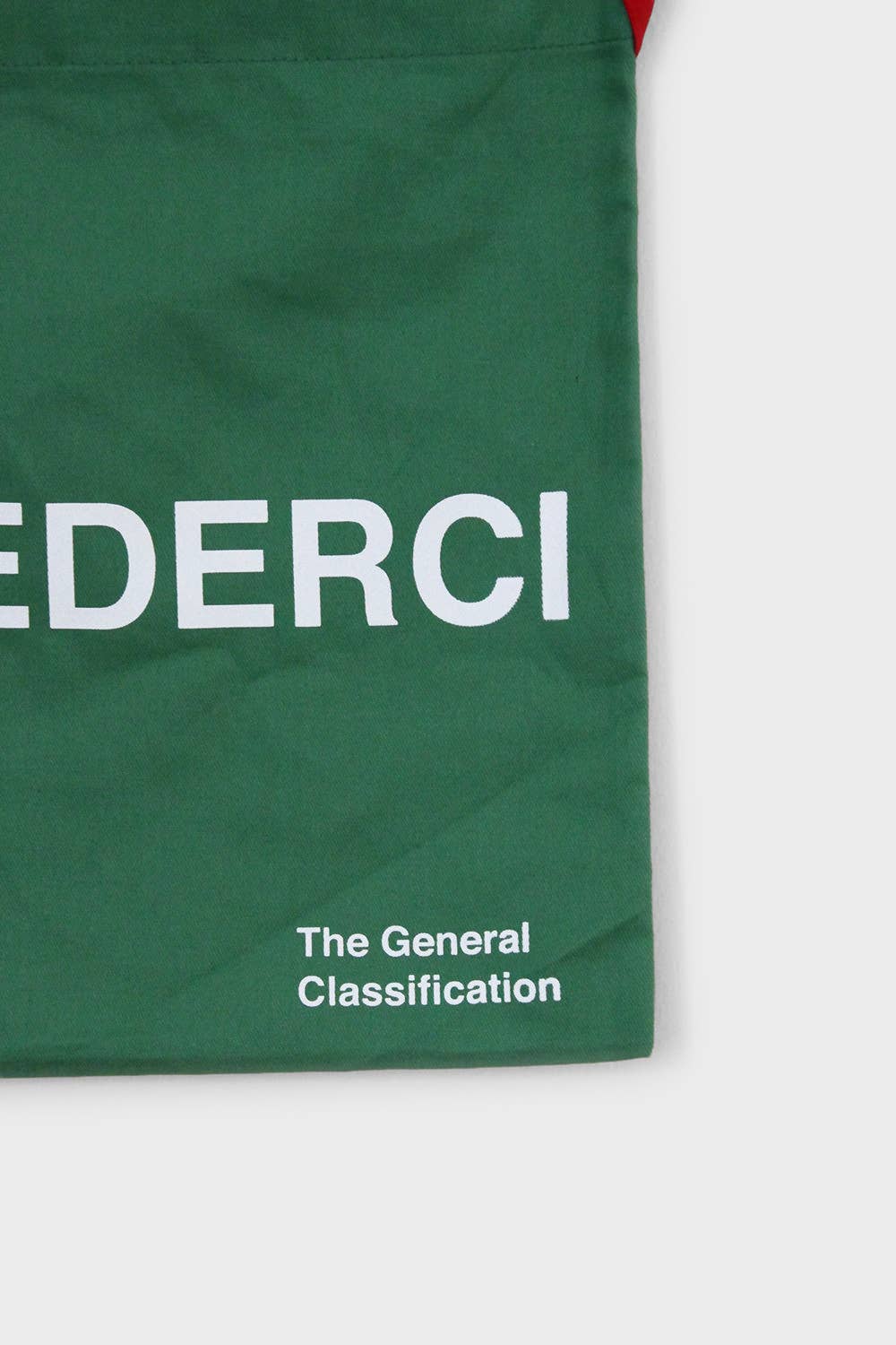 Green reusable canvas tote bag with red handles and bold white "Ciao" and ‘Arrivederci’ graphic by The General Classification. Eco-friendly cotton shopping bag with modern minimalist design, ideal for everyday use, groceries, travel, and casual fashion.
