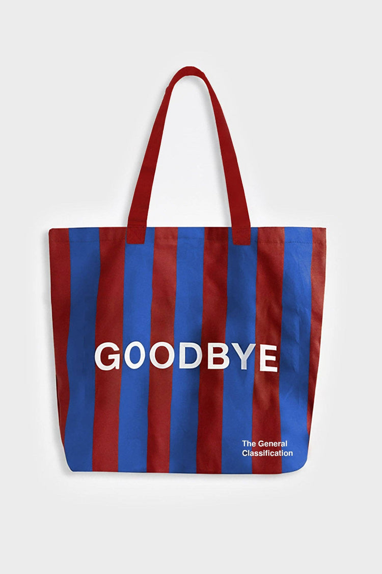 Red and navy stripe reusable canvas tote bag with red handles and bold white "hello" and ‘goodbye’ graphic by The General Classification. Eco-friendly cotton shopping bag with modern minimalist design, ideal for everyday use, groceries, travel, and casual fashion.