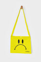 Yellow reusable canvas tote bag with yellow handles and bold black "Smiley Musette" graphic by The General Classification. Eco-friendly cotton shopping bag with modern minimalist design, ideal for everyday use, groceries, travel, and casual fashion.
