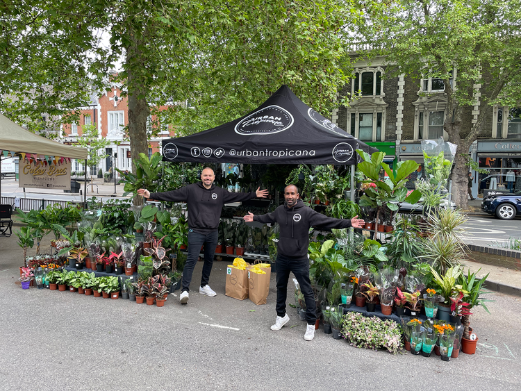 Lewis and Steve from Urban Tropicana standing with their house plants at Chiswick Flower Market 