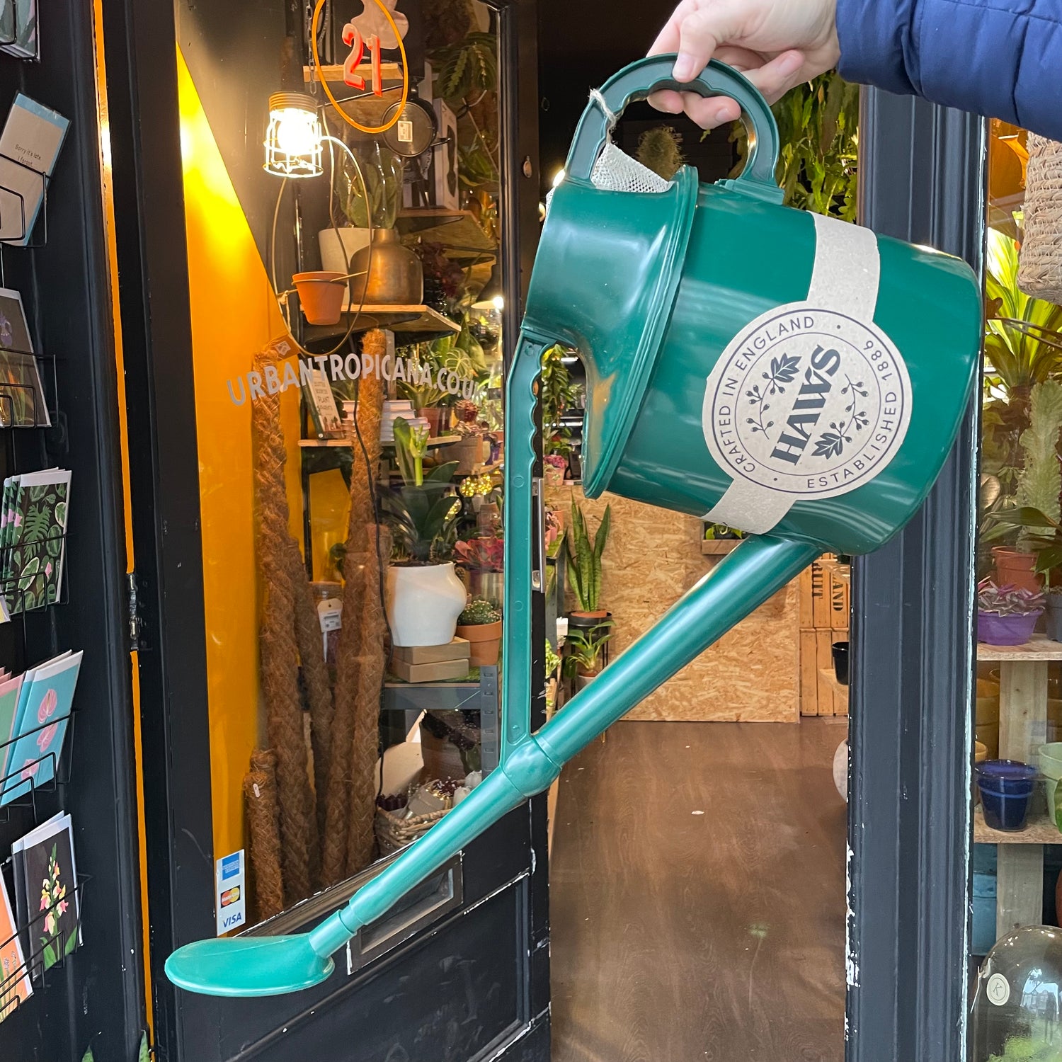 Haws - The Cradley Cascader Green Watering Can in front of Urban Tropicana&