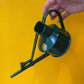 Haws - Langley Sprinker Watering Can in Green in front of a yellow background